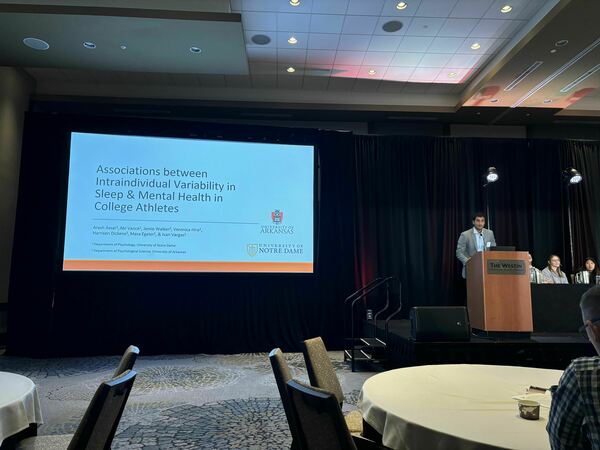 conference presentation with a cisgender man presenting at the annual behavioral sleep medicine conference.
